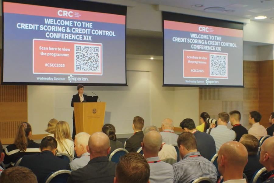 Speakers presenting at the Credit Scoring & Credit Control Conference XIX  in front of a room full of attendees